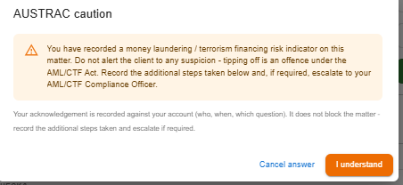 AUSTRAC caution dialog warning that tipping off the client is an offence, with an I understand acknowledgement button