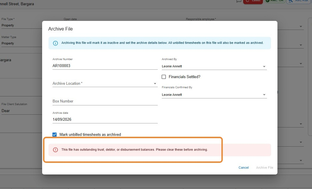 Archive File window showing the warning message: this file has outstanding trust, debtor, or disbursement balances, please clear these before archiving